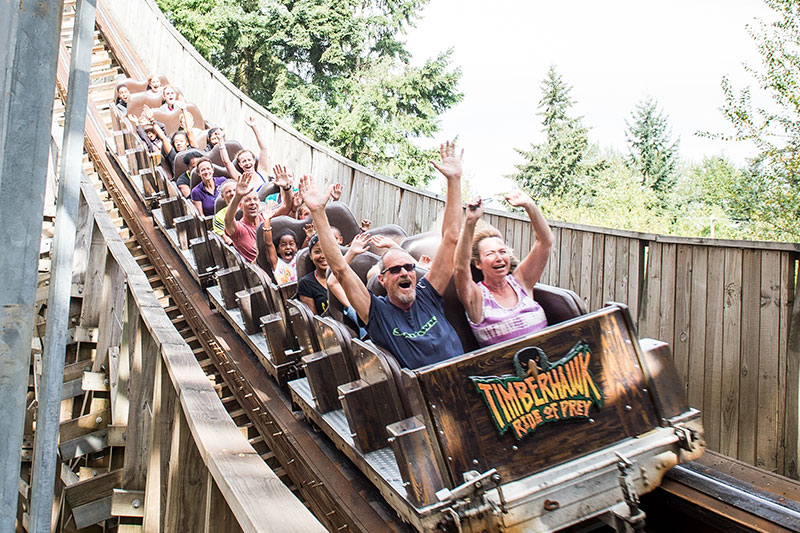 People Riding Wooden Rollercoaster