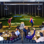 people playing topgolf